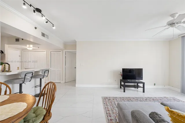 a view of a livingroom with furniture and a flat screen tv