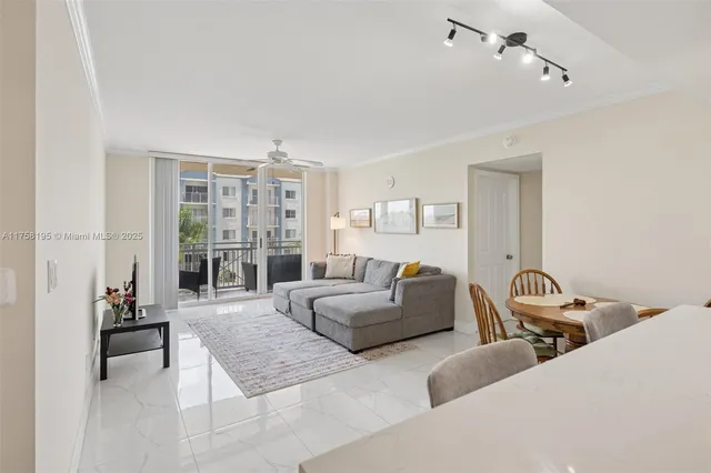 a bedroom with furniture and a large window