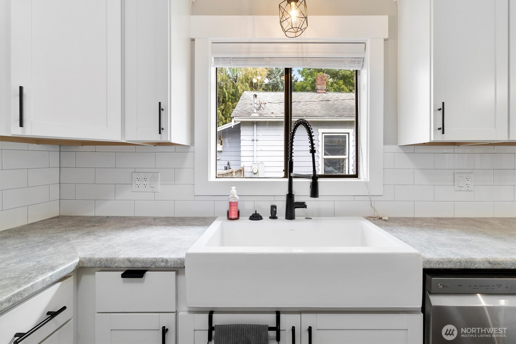 310 Second Street Sumas, WA 98295 - Photo 12 of 26 a kitchen with a sink and large window