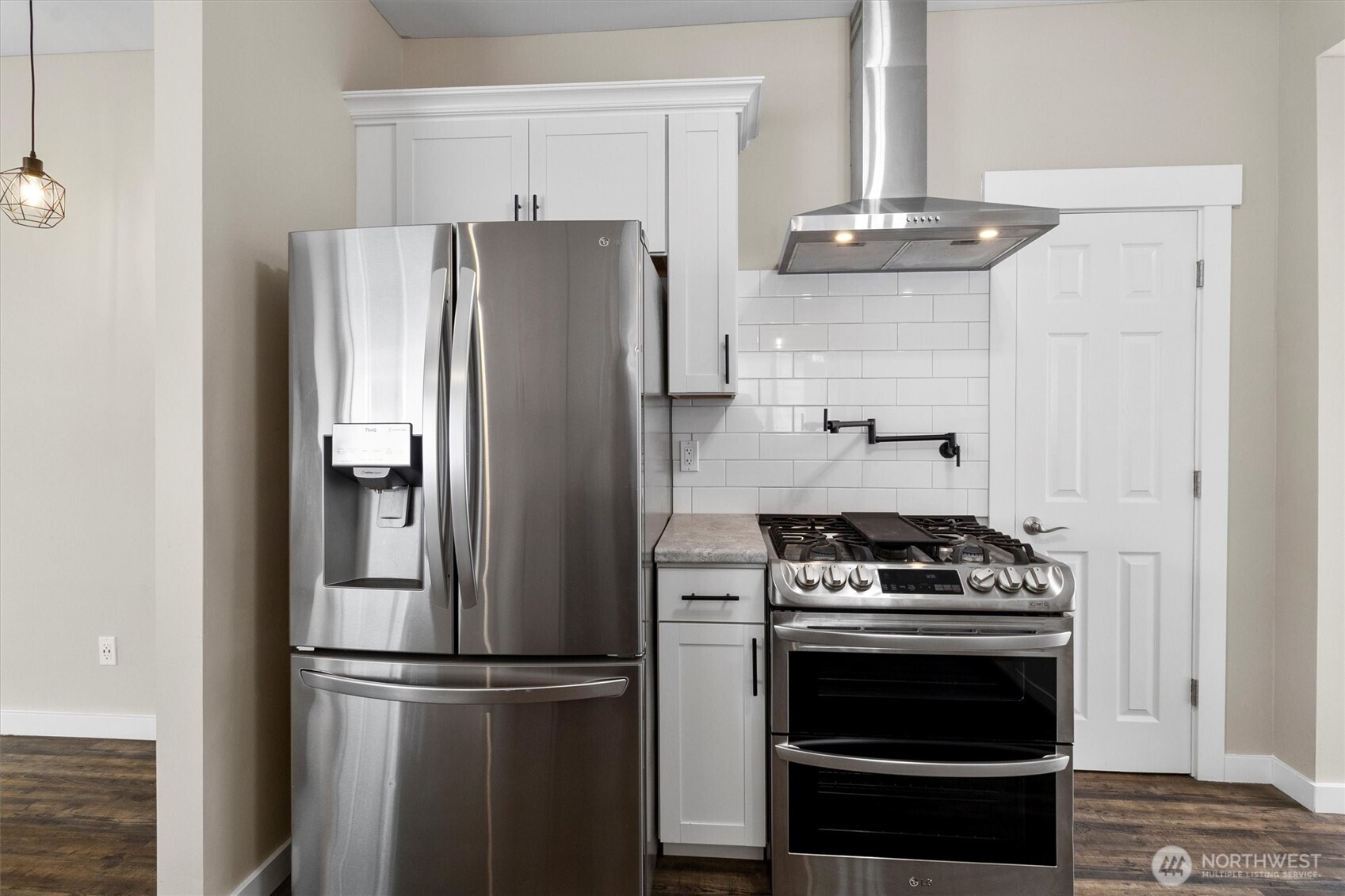 310 Second Street Sumas, WA 98295 - Photo 13 of 26 a kitchen with a stove and a refrigerator
