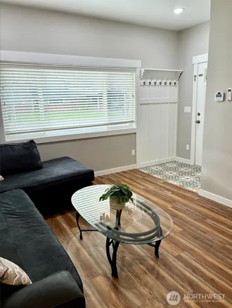 a living room with a couch and a table