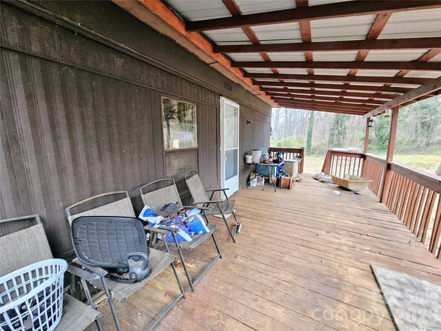 a view of a chairs and table in the patio