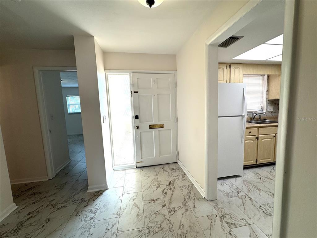 610 Indian Rocks Road North, Unit 103 Belleair Bluffs, FL 33770 - Photo 2 of 13 a view of a bathroom with a sink and a mirror