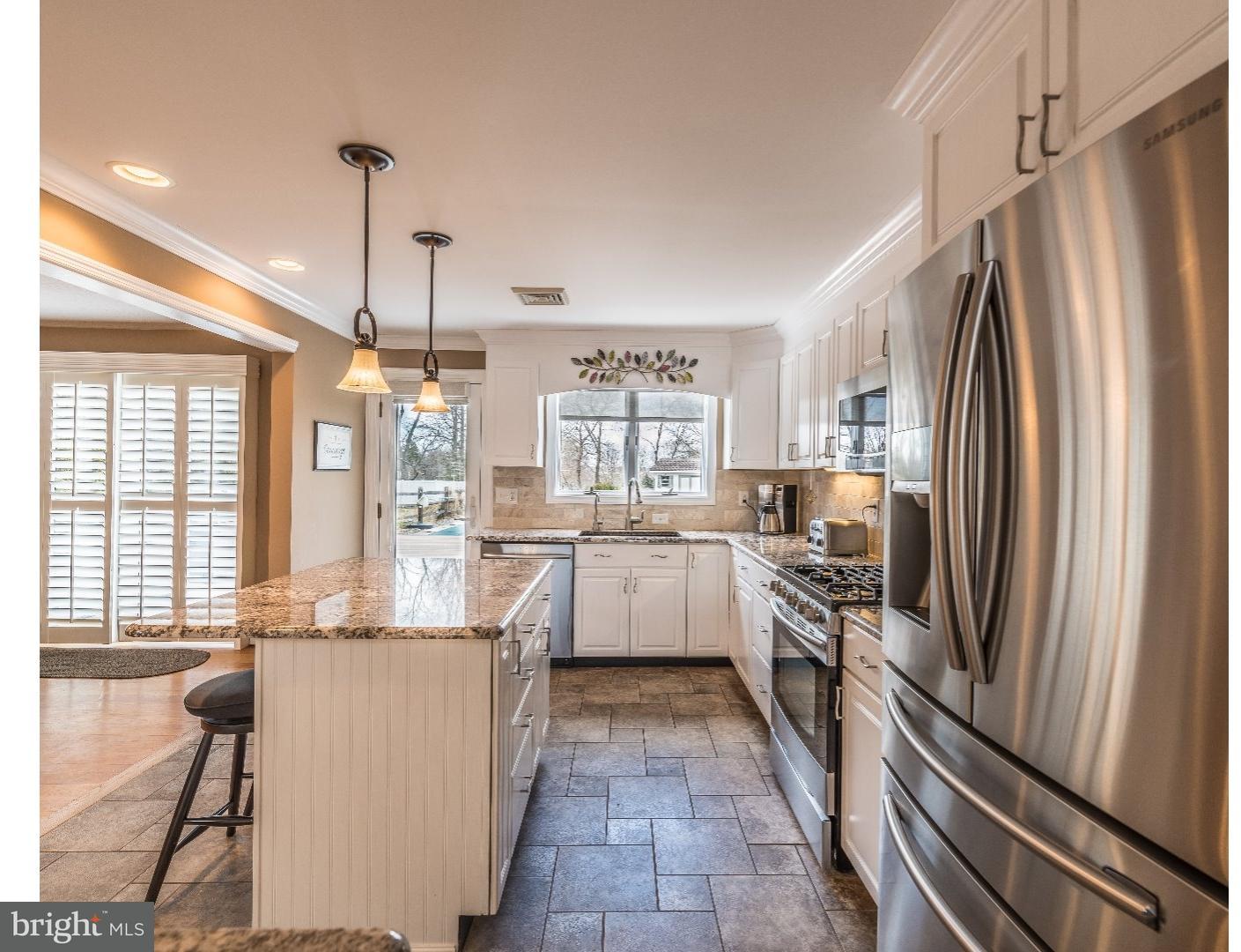 10 Doe Run Road Warrington, PA 18976 - Photo 2 of 7 a kitchen with white cabinets and stainless steel appliances