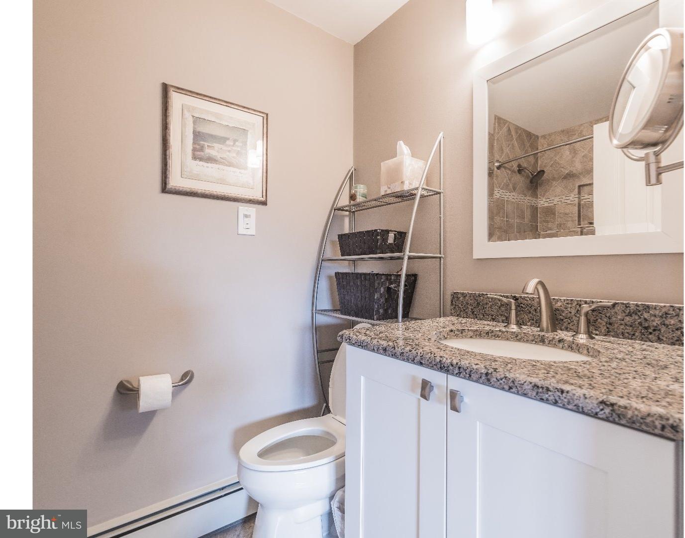 10 Doe Run Road Warrington, PA 18976 - Photo 6 of 7 a bathroom with a granite countertop sink and a toilet