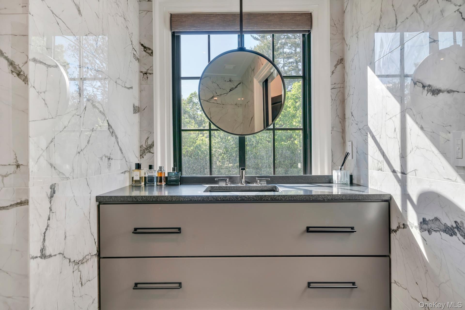 64 Cushman Road Scarsdale, NY 10583 - Photo 20 of 32 a close view of a sink and a mirror