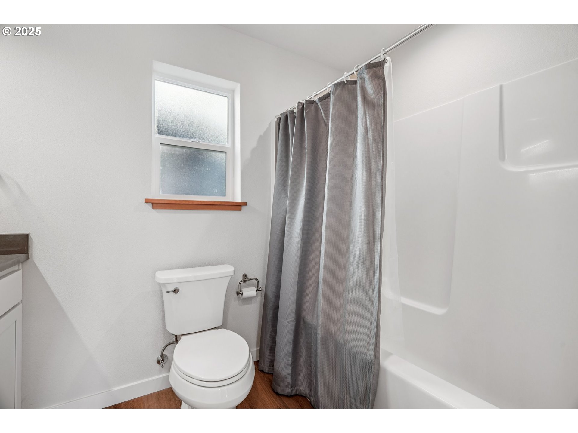 34326 Johnson's Landing Road, Unit E1 Scappoose, OR 97056 - Photo 14 of 21 a bathroom with a toilet and a shower