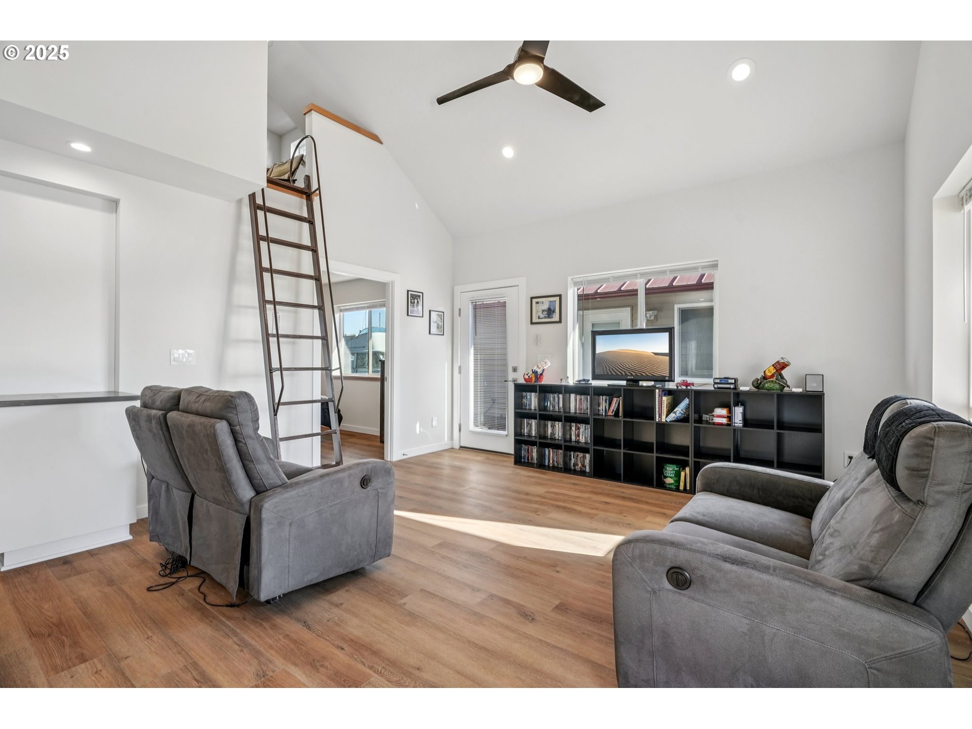 34326 Johnson's Landing Road, Unit E1 Scappoose, OR 97056 - Photo 3 of 21 a living room with furniture and wooden floor