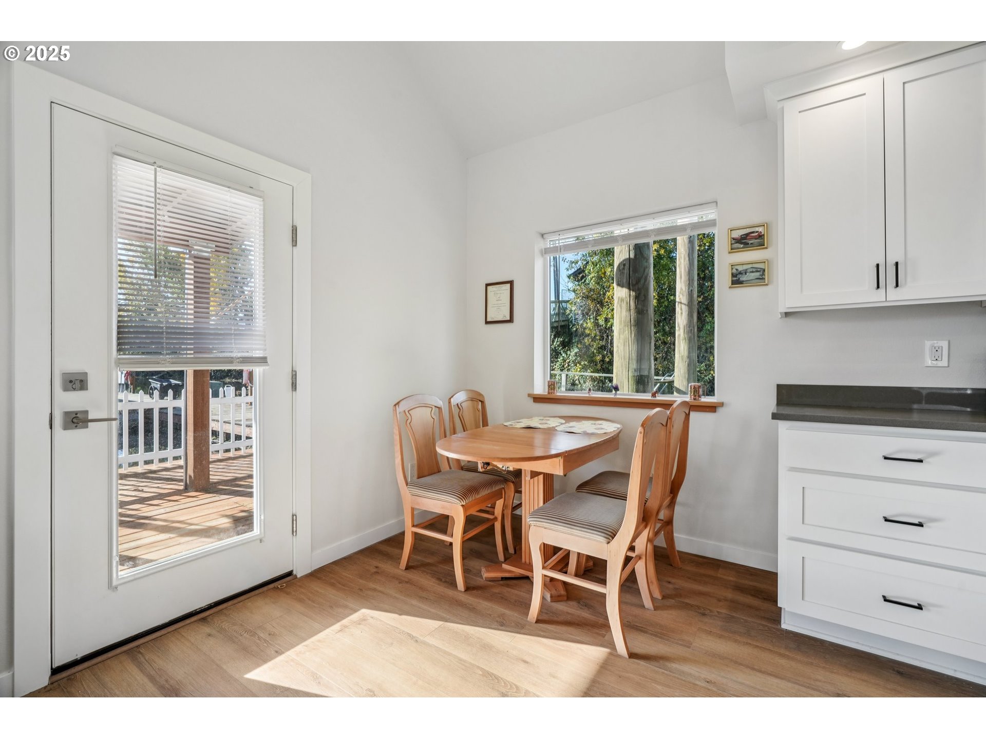 34326 Johnson's Landing Road, Unit E1 Scappoose, OR 97056 - Photo 7 of 21 a dining room with furniture and window