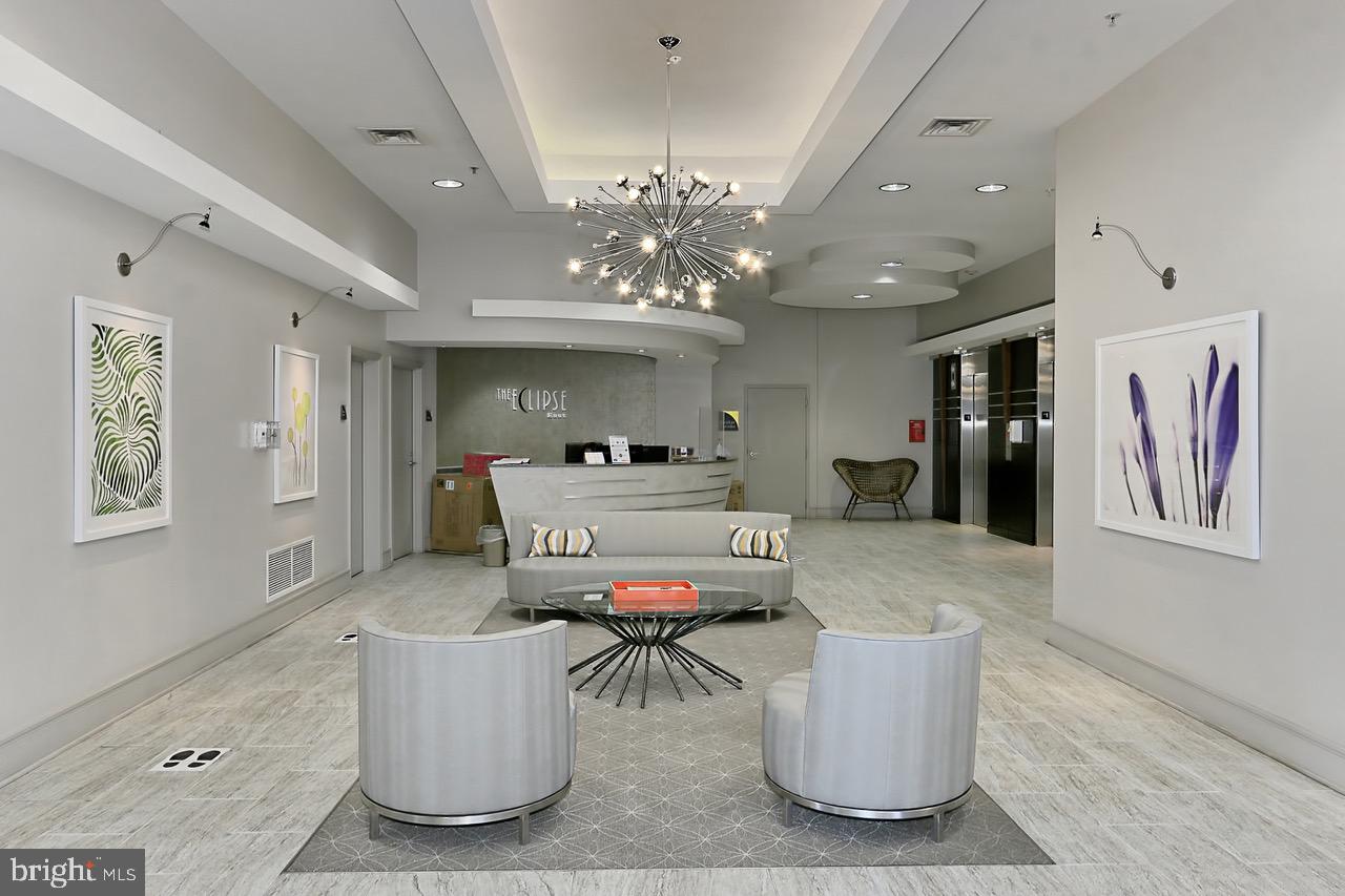 3650 South Glebe Road, Unit 147 Arlington, VA 22202 - Photo 16 of 31 a living room with furniture and a chandelier