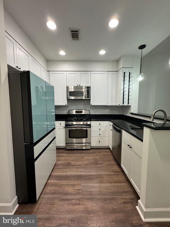 3650 South Glebe Road, Unit 147 Arlington, VA 22202 - Photo 2 of 31 a large kitchen with a large counter top stainless steel appliances and cabinets