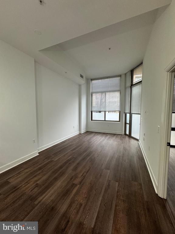 3650 South Glebe Road, Unit 147 Arlington, VA 22202 - Photo 6 of 31 wooden floor in an empty room with a window