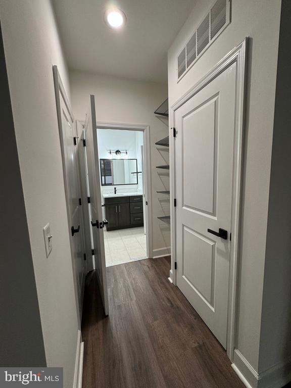 3650 South Glebe Road, Unit 147 Arlington, VA 22202 - Photo 9 of 31 a view of a hallway with wooden floor and a living room