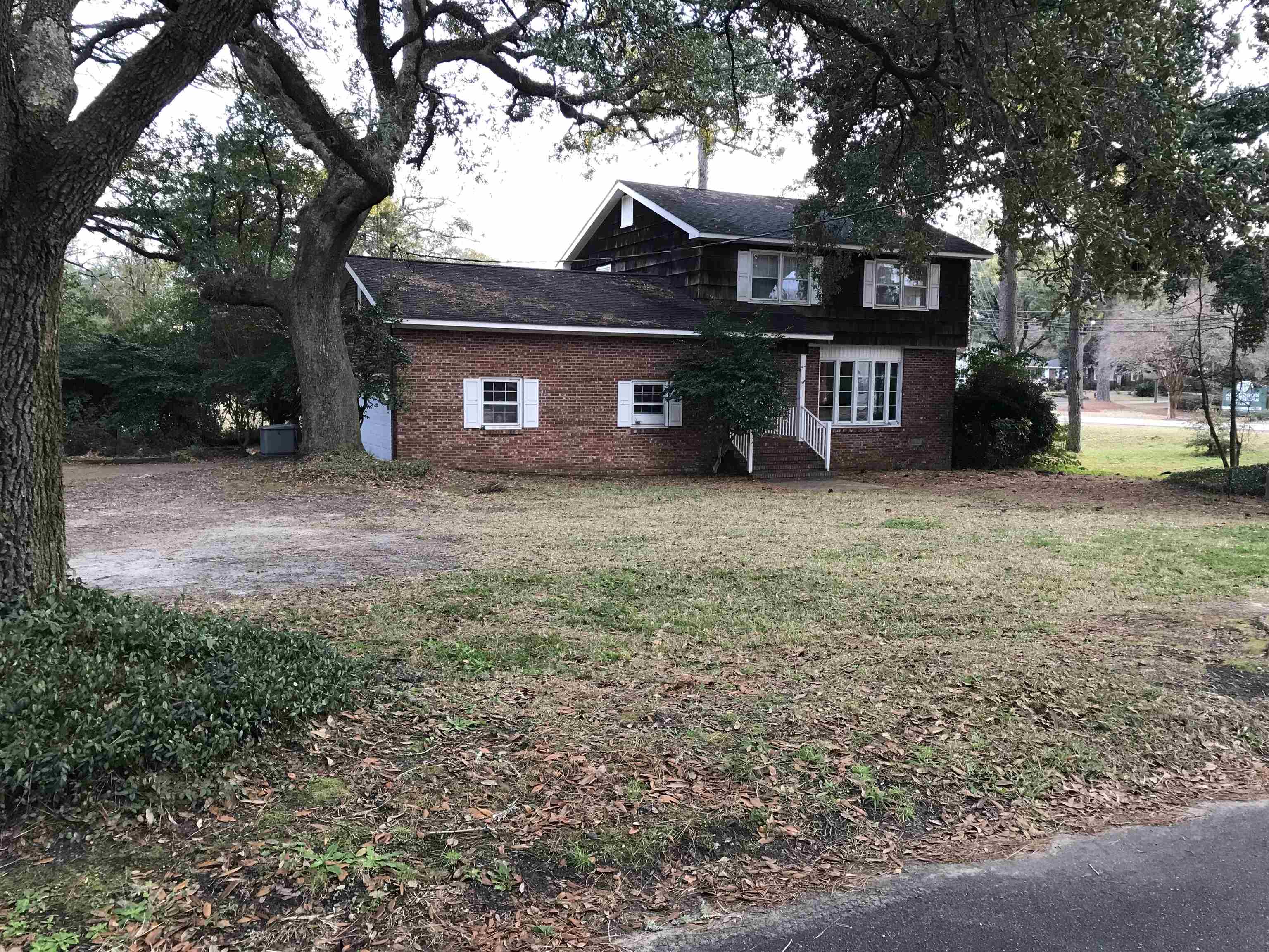 1201 Landgrave Street Georgetown, SC 29440 - Photo 1 of 38 View of front of house featuring brick siding and a front lawn