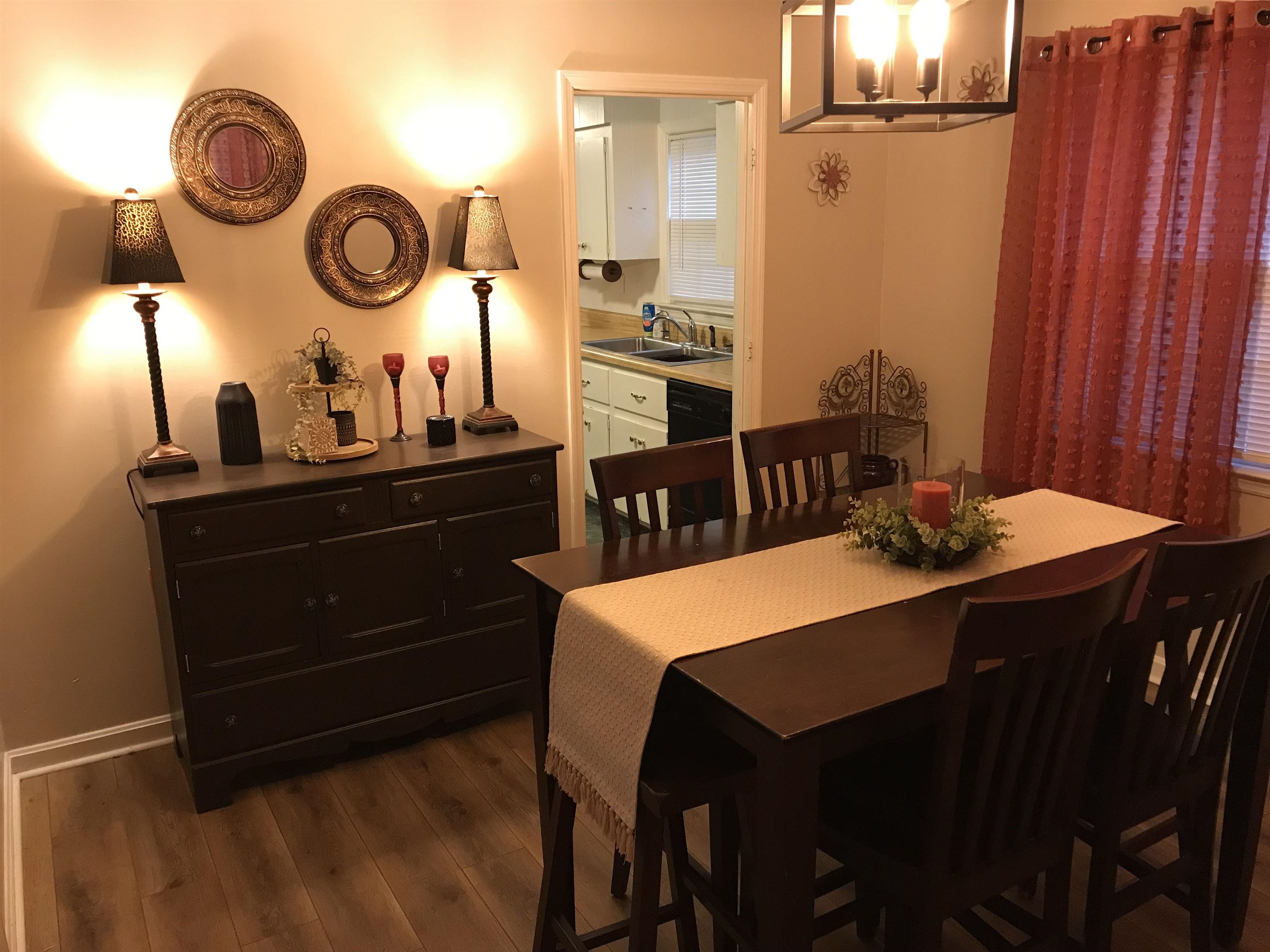 1201 Landgrave Street Georgetown, SC 29440 - Photo 14 of 38 Dining room featuring dark wood-style flooring and baseboards