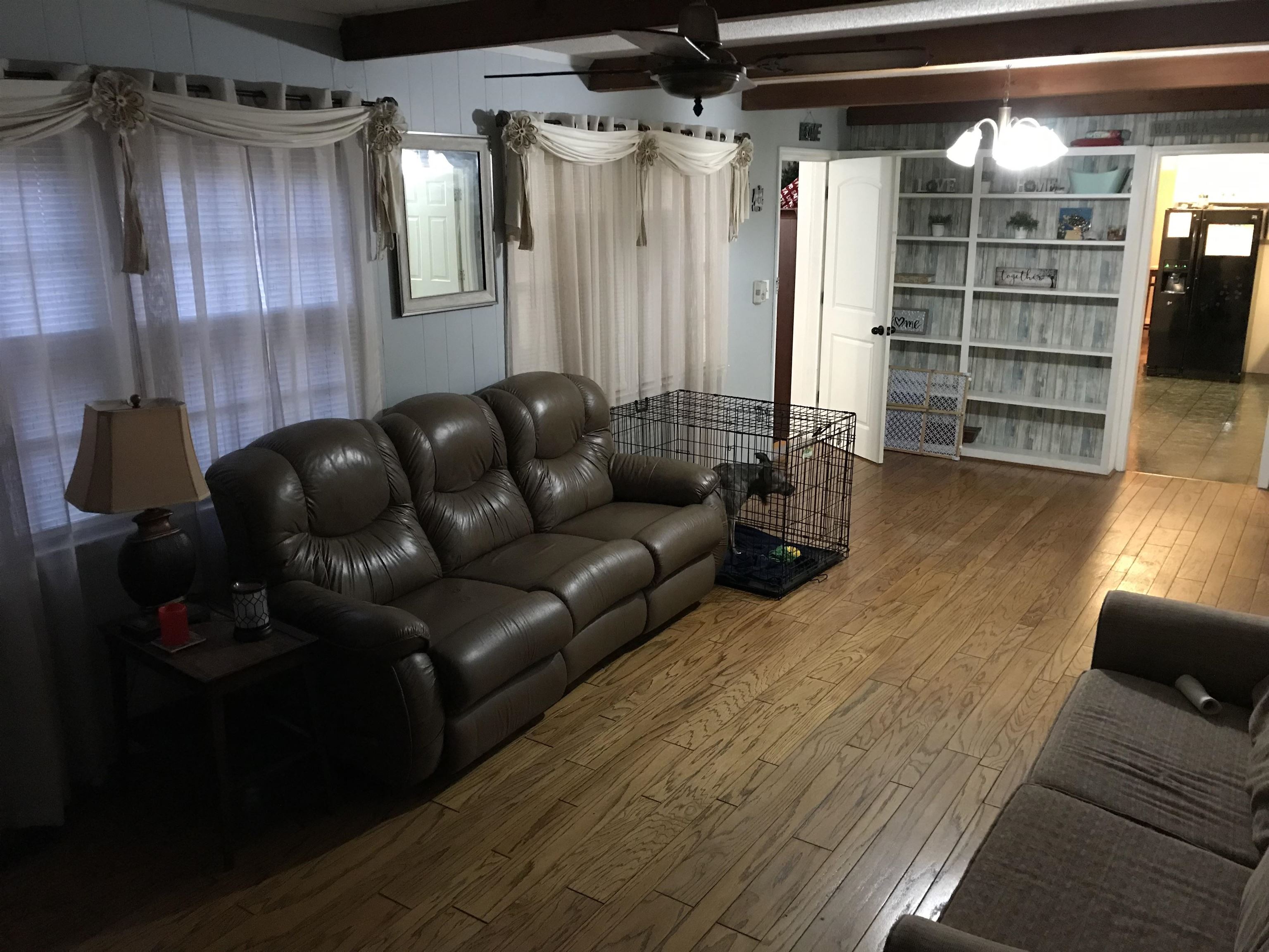 1201 Landgrave Street Georgetown, SC 29440 - Photo 19 of 38 Living room featuring beamed ceiling and hardwood / wood-style floors