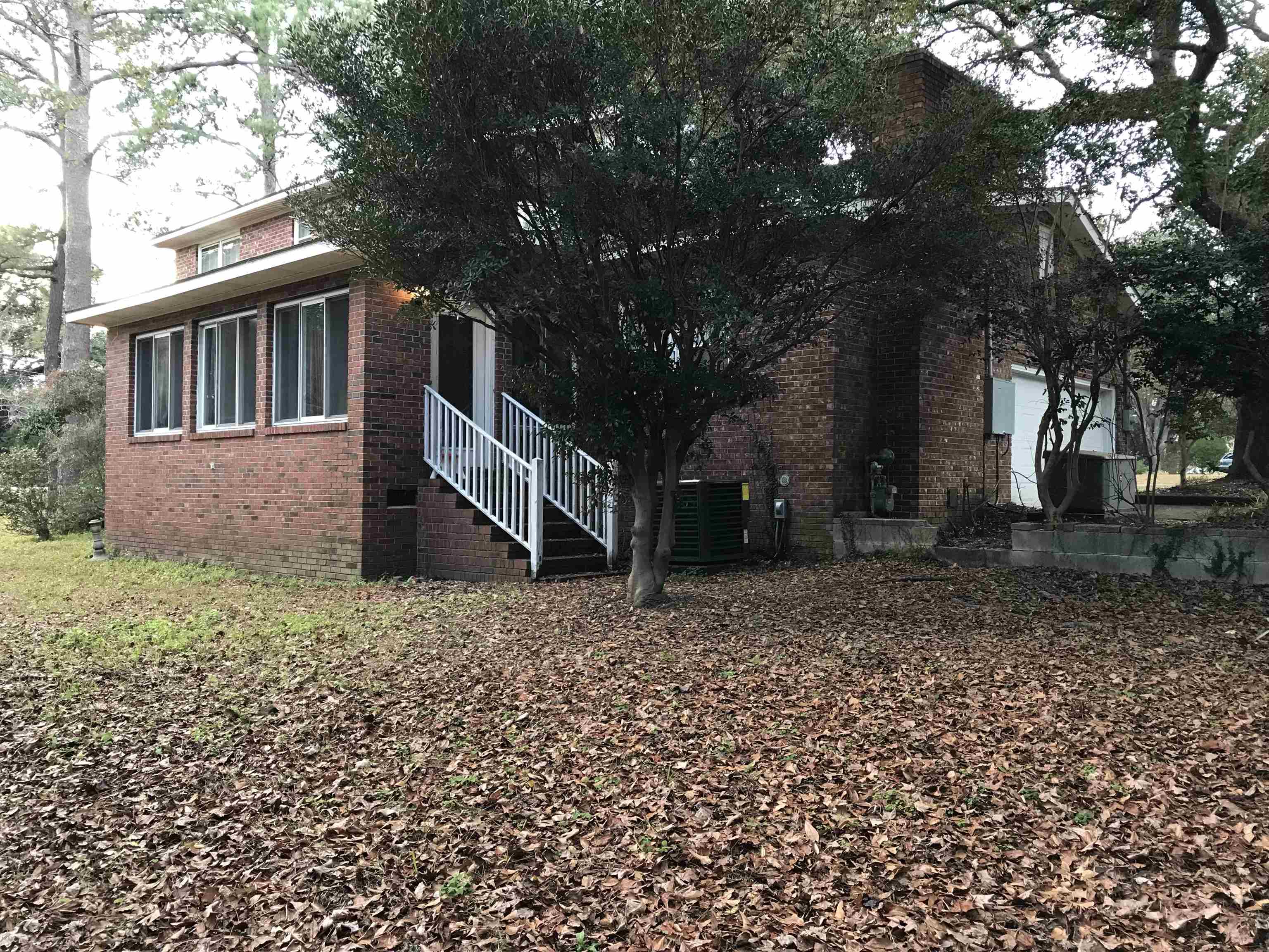 1201 Landgrave Street Georgetown, SC 29440 - Photo 5 of 38 View of side of property featuring brick siding