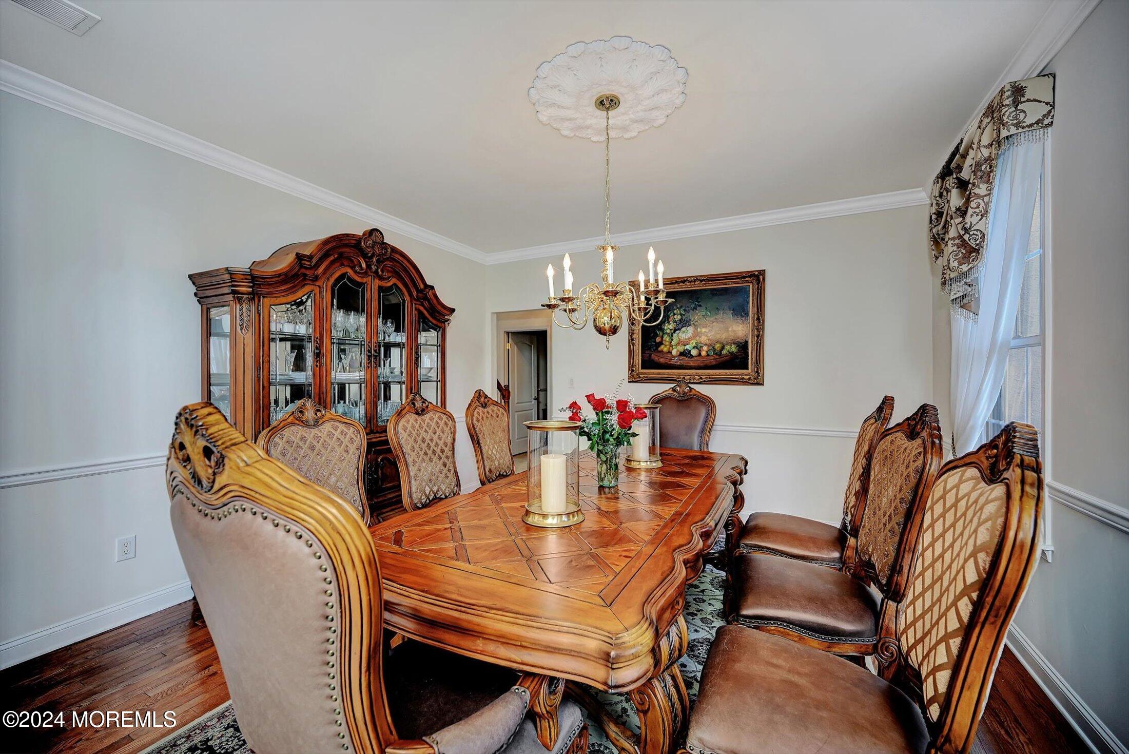 25 Wilson Boulevard Jackson, NJ 08527 - Photo 11 of 61 a view of a dining room with furniture wooden floor and chandelier
