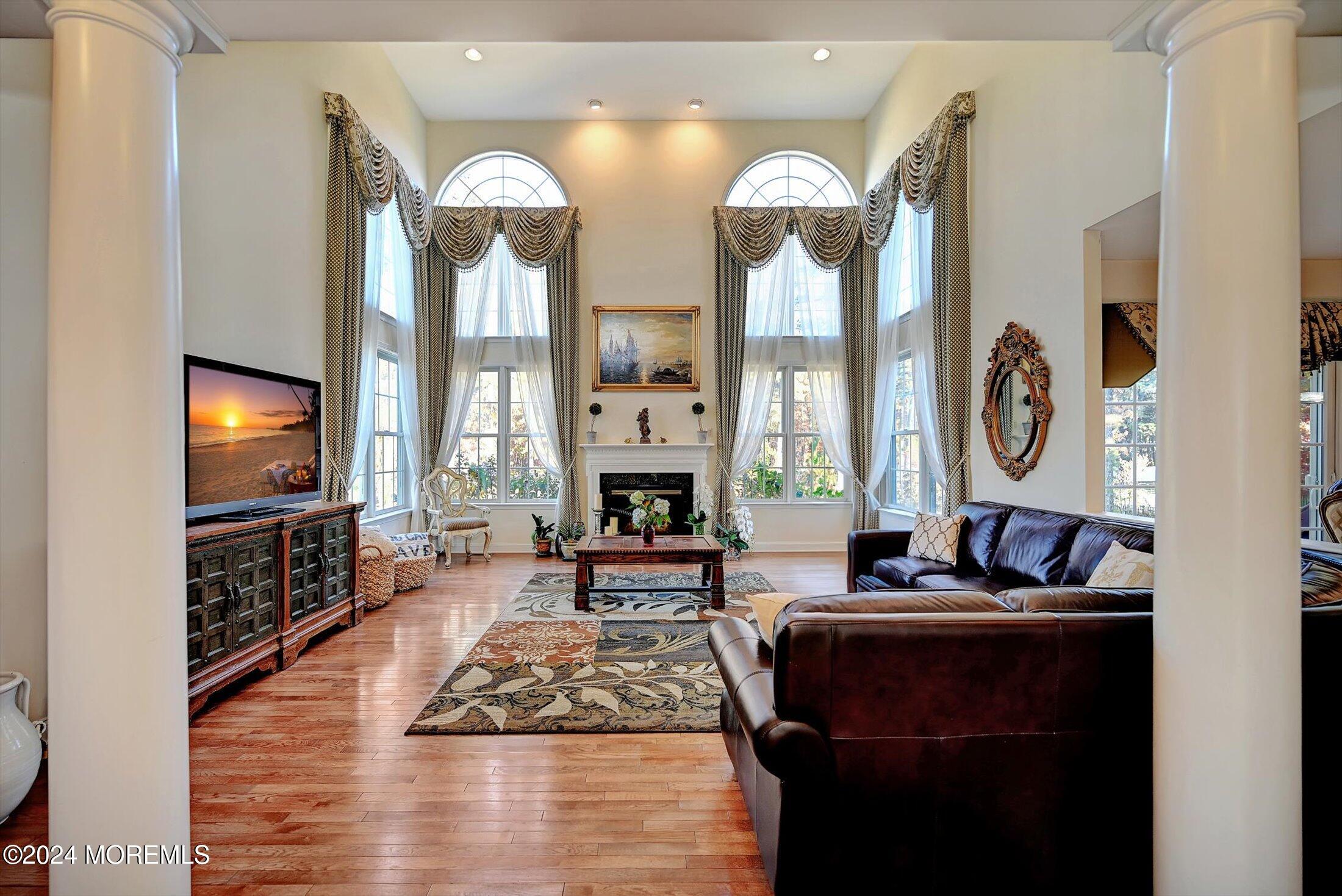 25 Wilson Boulevard Jackson, NJ 08527 - Photo 12 of 61 a living room with furniture a large window and a fireplace
