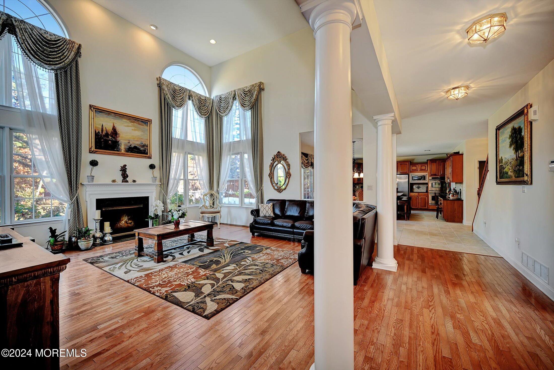 25 Wilson Boulevard Jackson, NJ 08527 - Photo 15 of 61 a living room with furniture a fireplace and a table