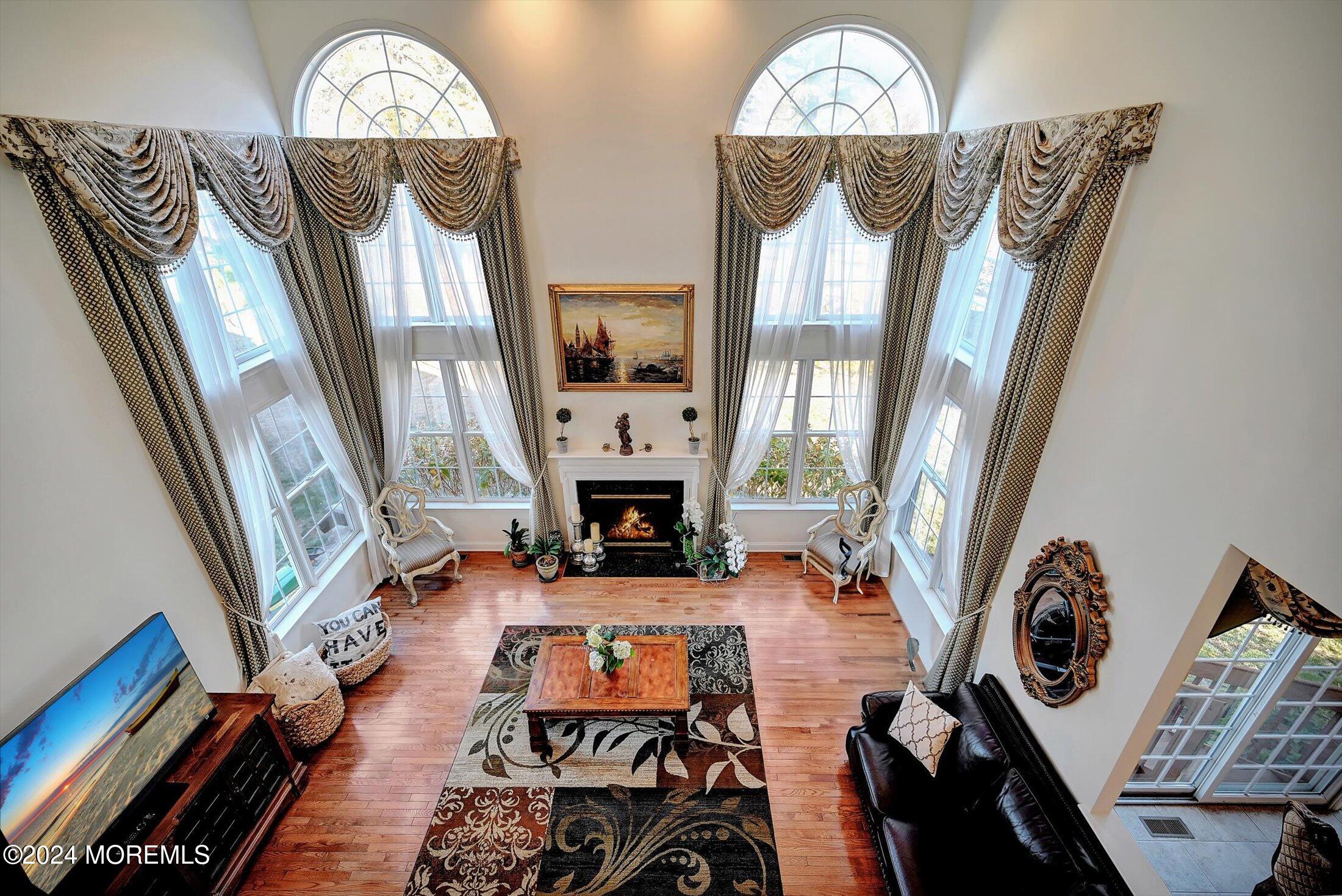 25 Wilson Boulevard Jackson, NJ 08527 - Photo 17 of 61 a view of a livingroom with furniture a fireplace window and wooden floor