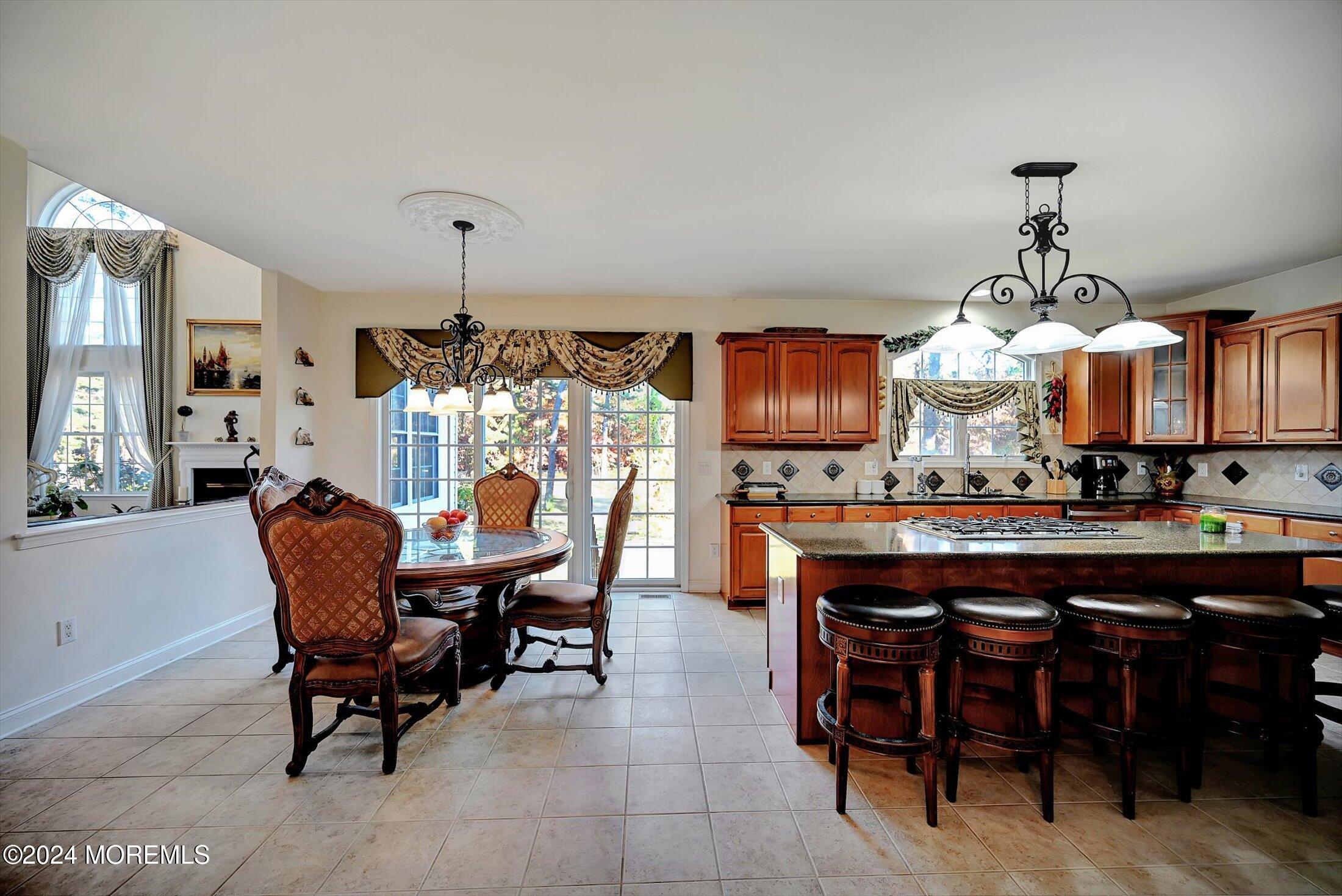 25 Wilson Boulevard Jackson, NJ 08527 - Photo 22 of 61 a dining room filled chandelier and wooden furniture