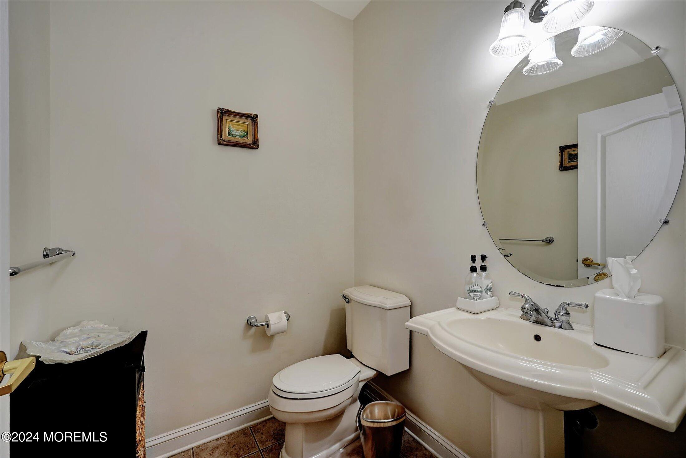 25 Wilson Boulevard Jackson, NJ 08527 - Photo 28 of 61 a bathroom with a sink mirror and toilet