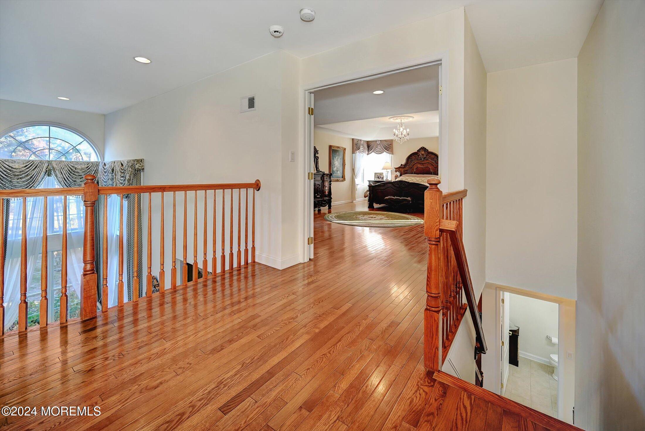 25 Wilson Boulevard Jackson, NJ 08527 - Photo 32 of 61 a view of a hallway with wooden floor and stairs