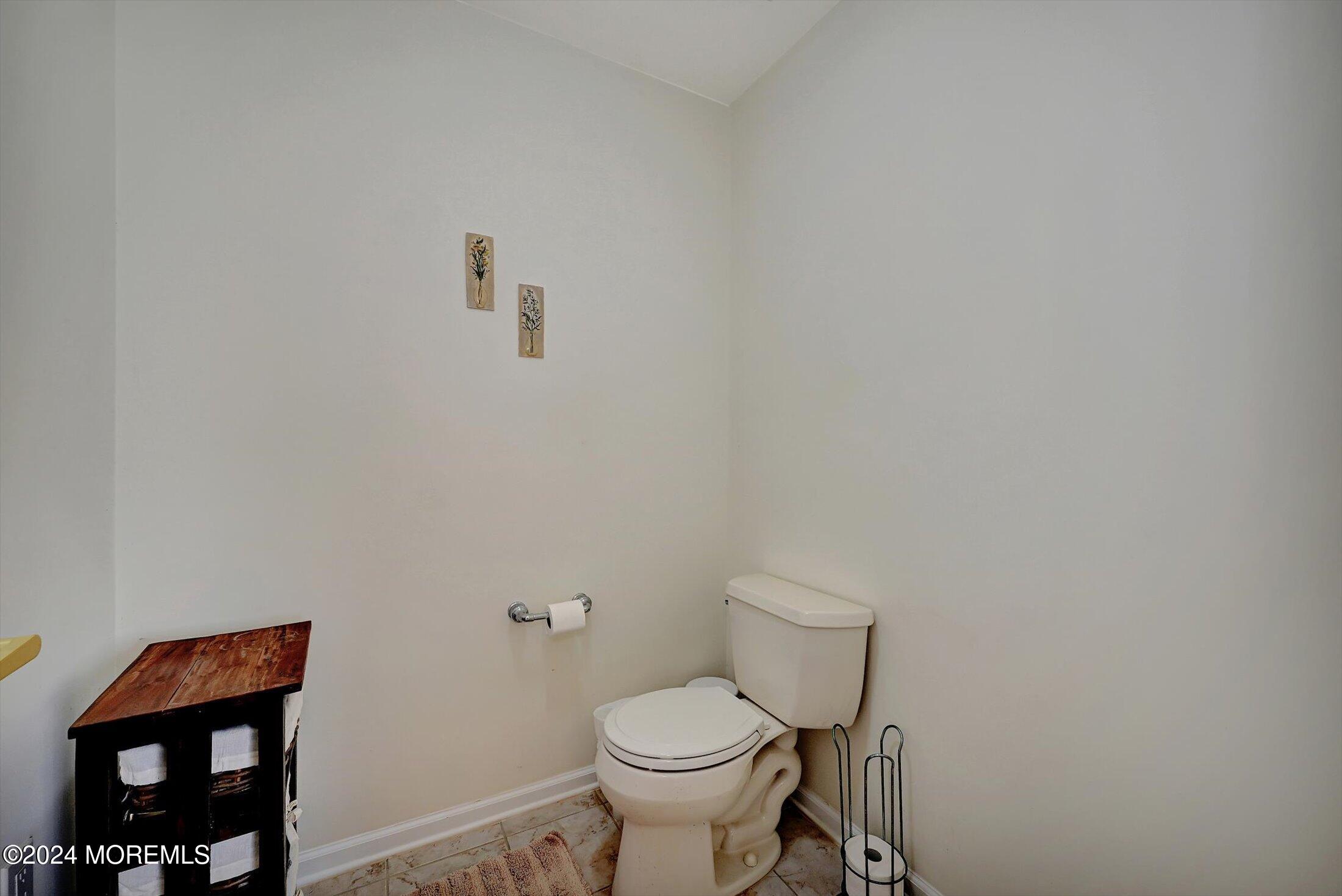 25 Wilson Boulevard Jackson, NJ 08527 - Photo 39 of 61 a white toilet sitting next to a white cabinet