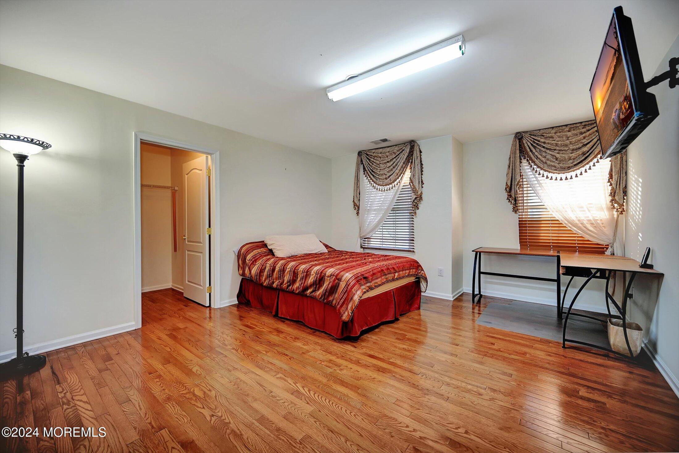 25 Wilson Boulevard Jackson, NJ 08527 - Photo 40 of 61 a bedroom with a bed and wooden floor