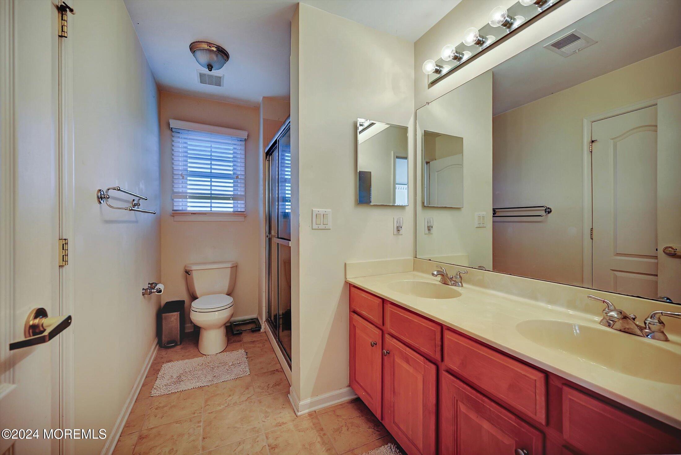 25 Wilson Boulevard Jackson, NJ 08527 - Photo 43 of 61 a bathroom with a sink and a mirror