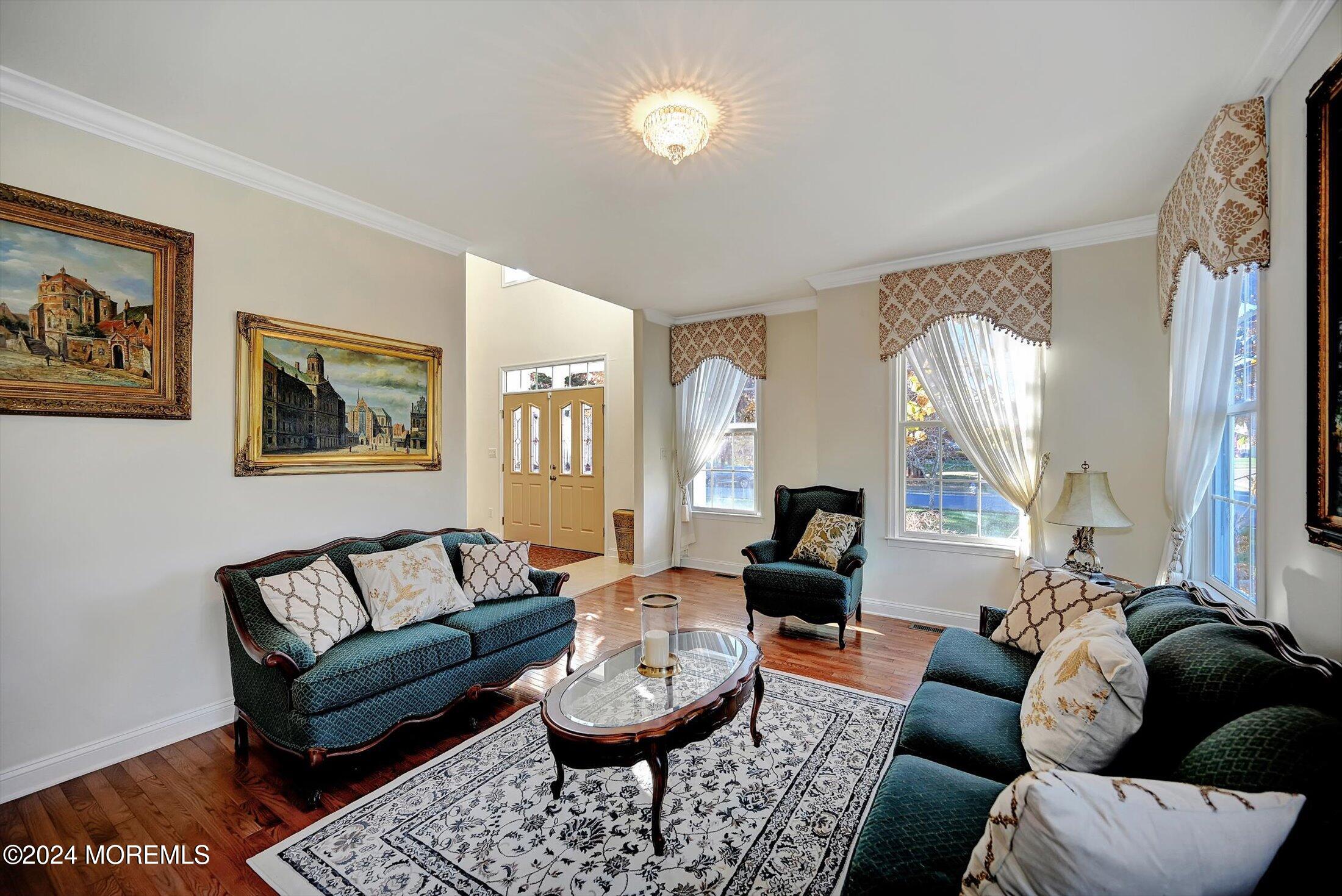 25 Wilson Boulevard Jackson, NJ 08527 - Photo 10 of 61 a living room with furniture and a large mirror next to a window