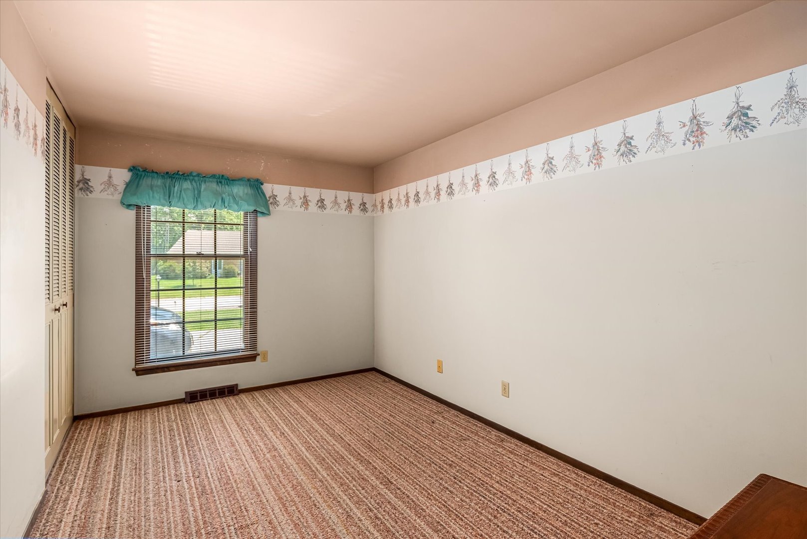 33 Somerset Road Montgomery, IL 60538 - Photo 13 of 17 a view of an empty room with wooden floor and a window