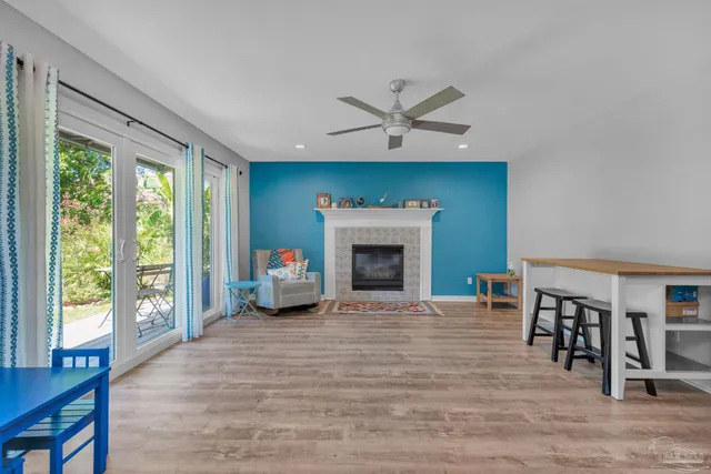 a view of an empty room with furniture and a fireplace