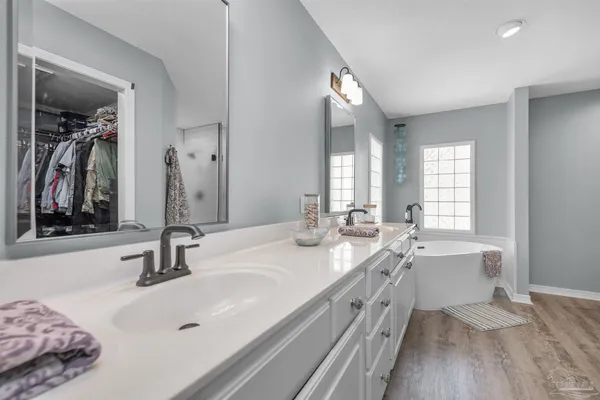 a bathroom with a sink toilet and a mirror