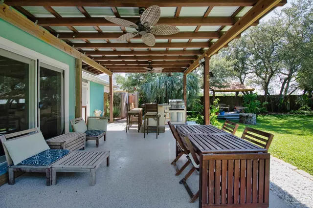 a view of a swimming pool with a patio
