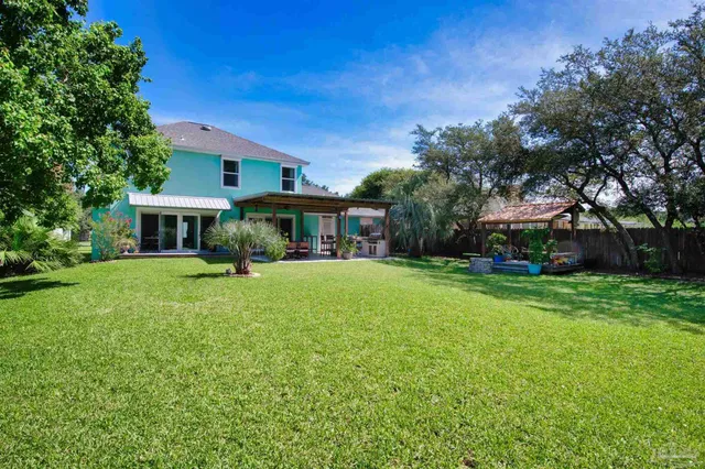 a view of a garden with a building in the background