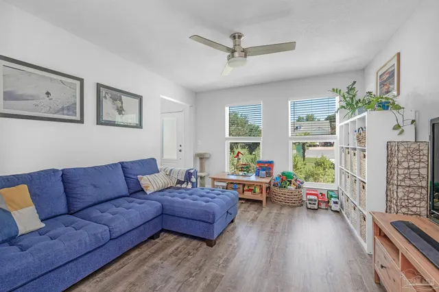 a living room with furniture and a large window