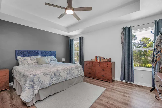 a bedroom with a bed and a dresser