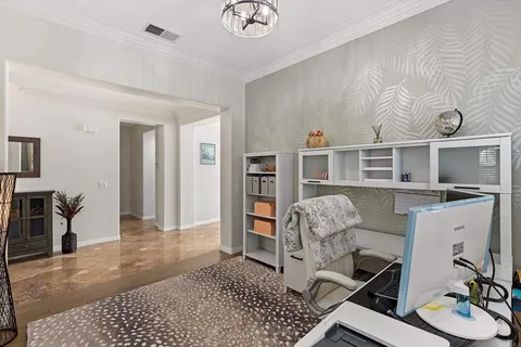 a large kitchen with a table and chairs in it