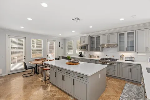 a view of a sink and washer and dryer