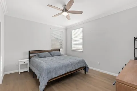 a bedroom with a bed and window