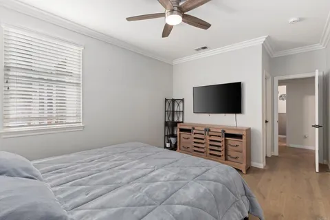 a view of a balcony with wooden floor and fence