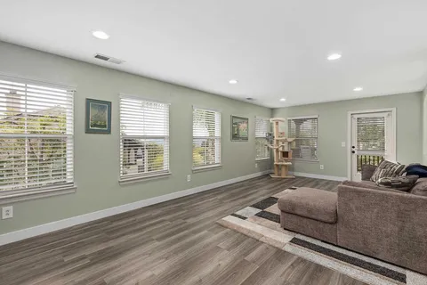a view of a swimming pool with sitting area