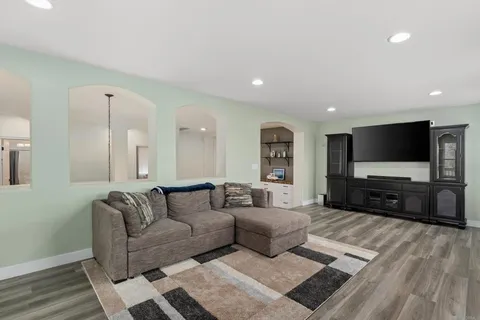 a backyard of a house with table and chairs