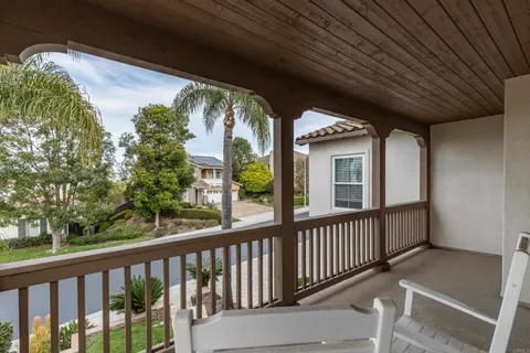 a view of a swimming pool with lounge chairs