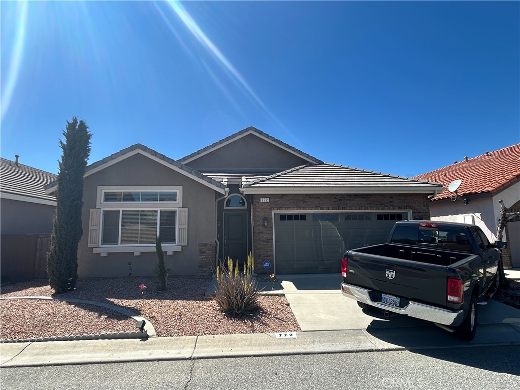 a front view of a house with garage
