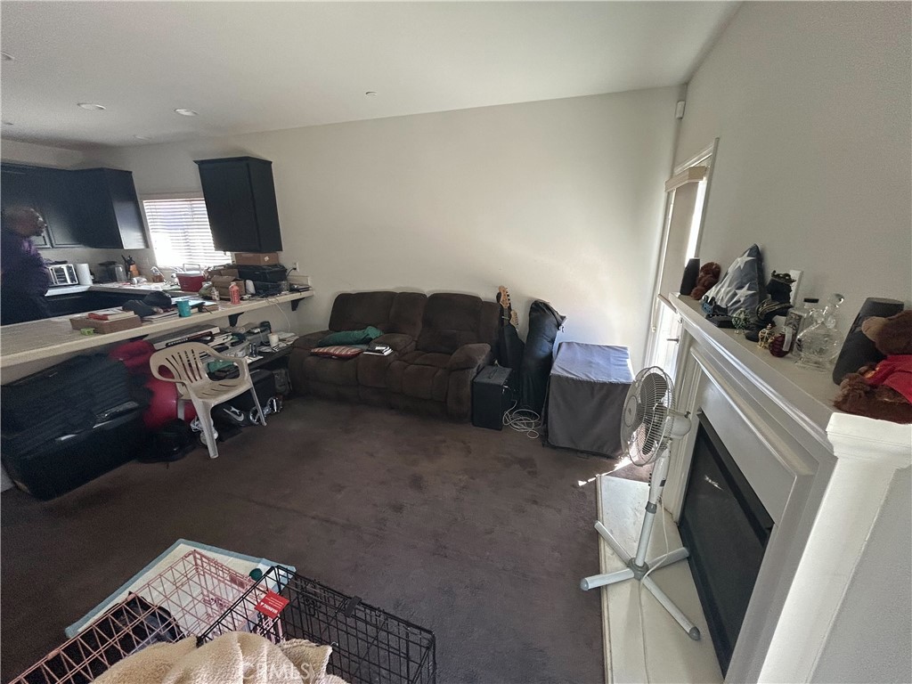 772 St Alban Road San Jacinto, CA 92583 - Photo 11 of 25 a living room with furniture and a flat screen tv