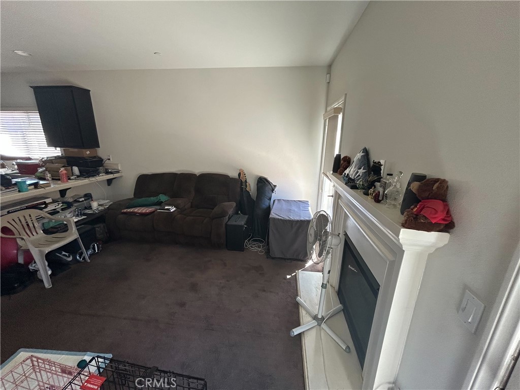 772 St Alban Road San Jacinto, CA 92583 - Photo 12 of 25 a living room with furniture and a flat screen tv