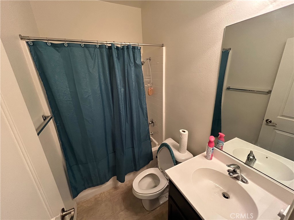 772 St Alban Road San Jacinto, CA 92583 - Photo 14 of 25 a bathroom with a sink and a mirror